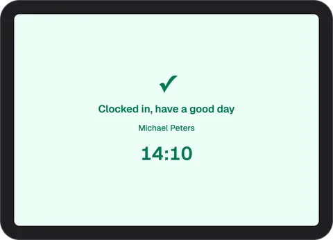 Green InShift terminal screen “Clocked in, have a good day” with the name Michael Peters and the time 14:10
